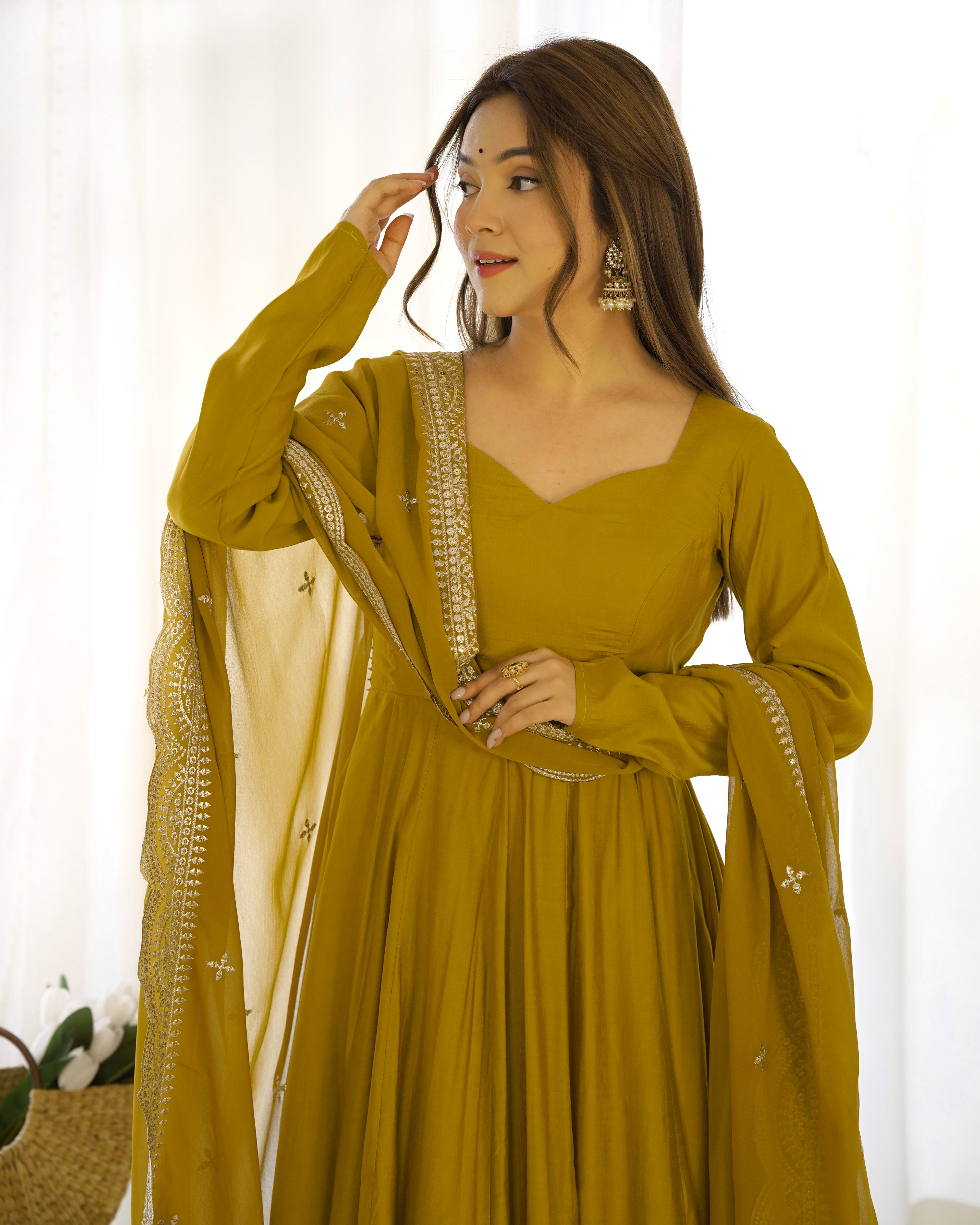 Divine Olive Green Colored Heavy Roman Silk Chanderi Anarkali Gown Divine Olive Green Colored Heavy Roman Silk Chanderi Anarkali Gown